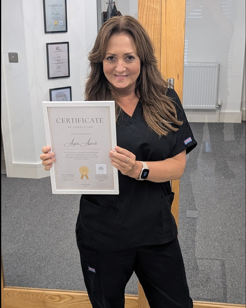 Scalp micropigmentation practitioner holding training certificate